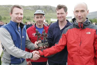 (From L to R) Dave Suddes of Lowe Alpine and Martin Stone, LAMM organiser, present the Elite winners, Alec Keith and Kenny Riddle with the LAMM trophy